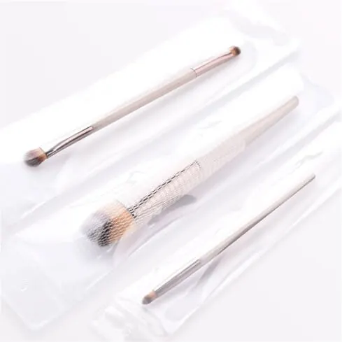 Tiga Premium Brushes bergagang champagne dalam plastik